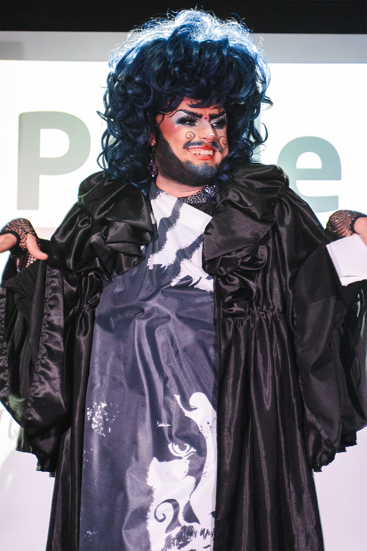 Edinburgh drag icon, Mystika Glamoor, on stage, hosting the Showcase.