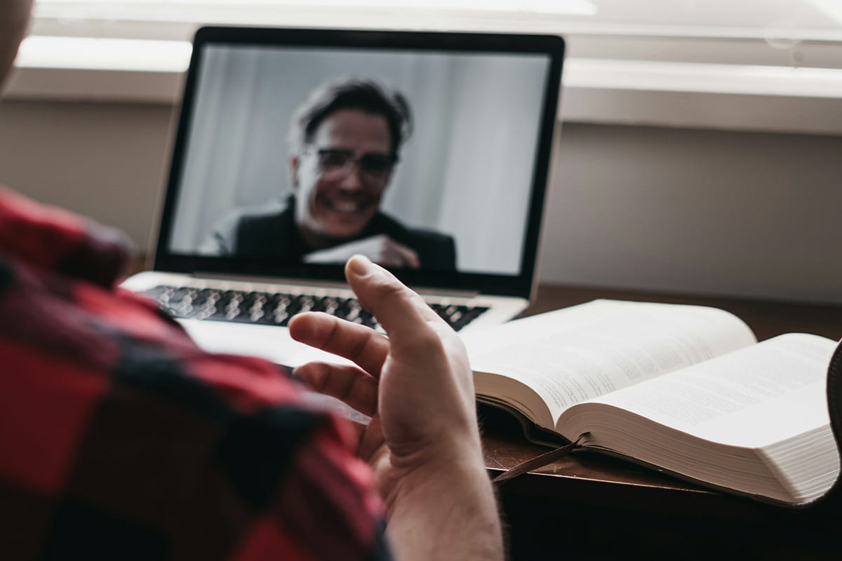 Person speaking to another on an online video call